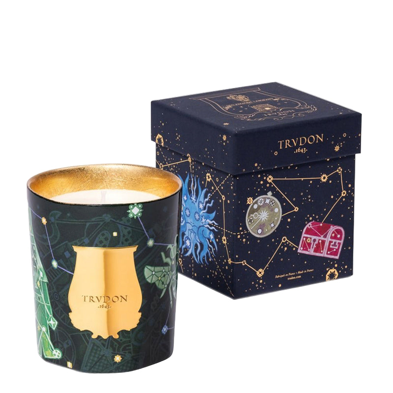 Decorative candle with Trudon branding, accompanied by a matching box on a light gray background. Holiday 2025 fir candle