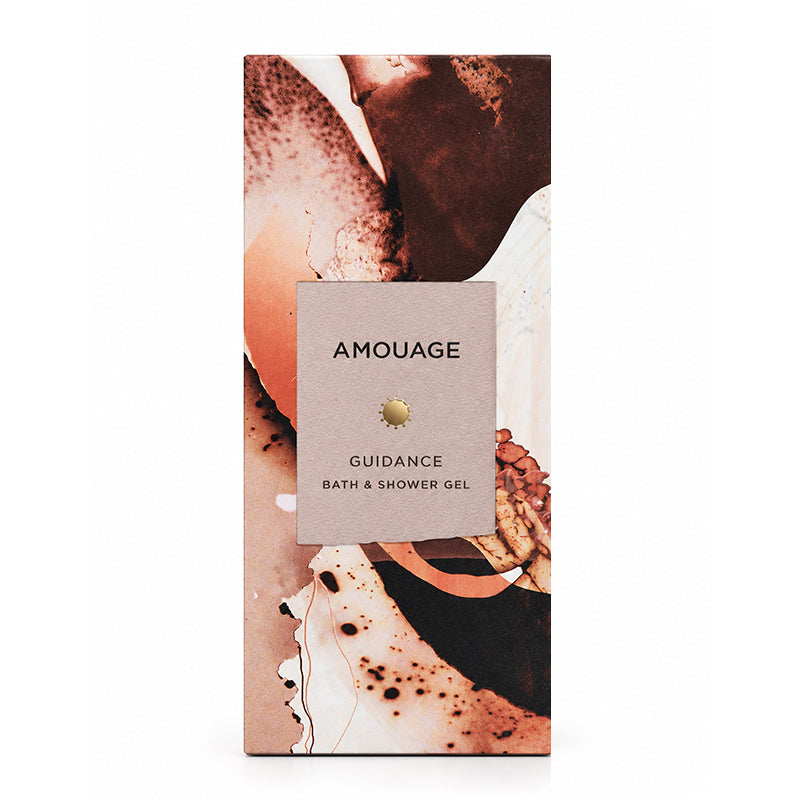 A tall rectangular product box for Amouage Guidance Bath & Shower Gel, featuring an abstract art print in warm earthy tones with a central beige label.