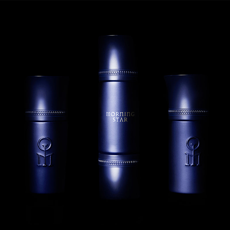 3 Morning Star fragrance bottles in deep blue against a black background