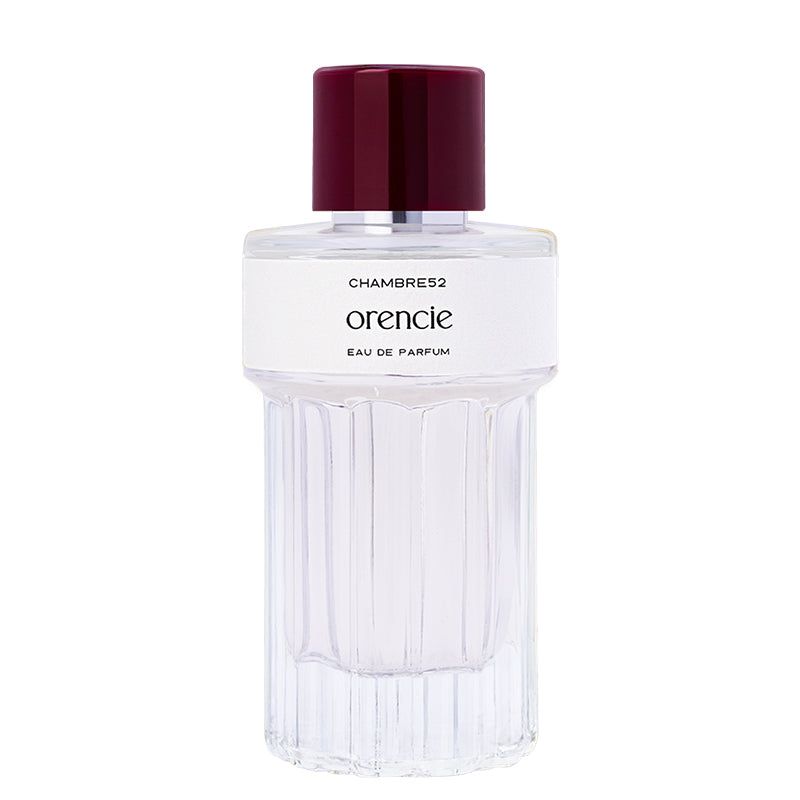 Perfume bottle with a white label on a white background