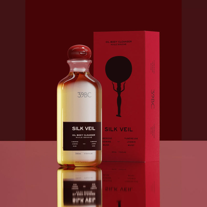 Silk Veil oil body cleanser bottle and packaging on a red background