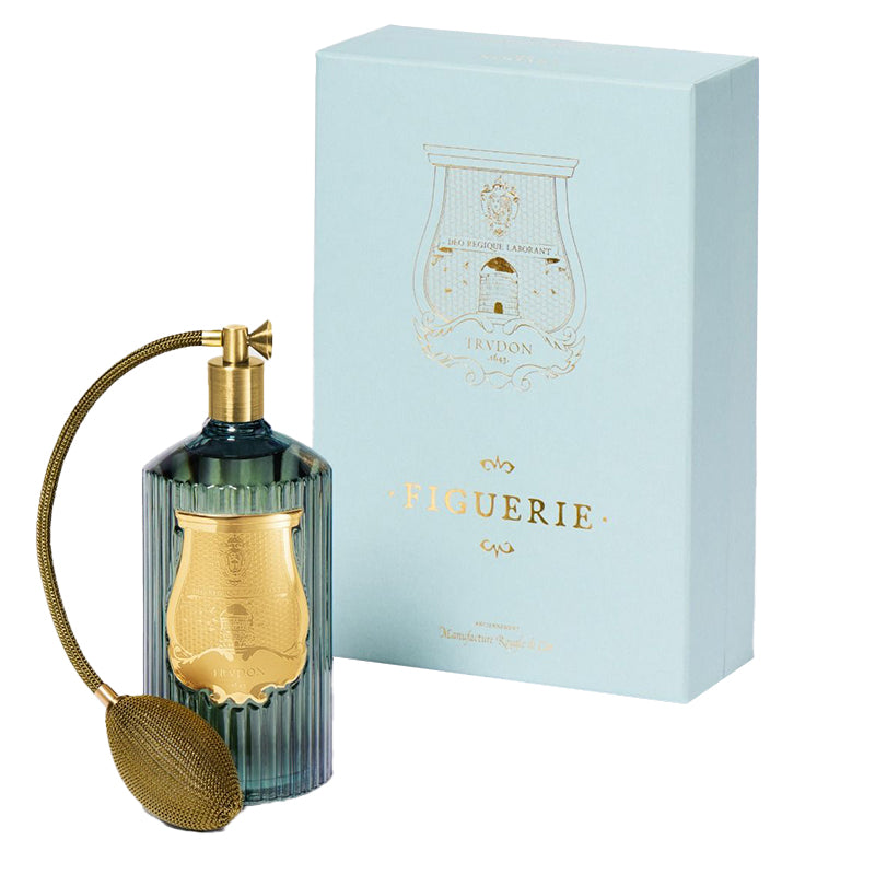 Trudon Figuerie room spray bottle and box with gold cap and nozzle on a white background