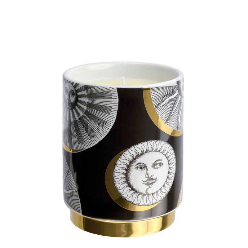 Ceramic tumbler with sun and moon design on a black background