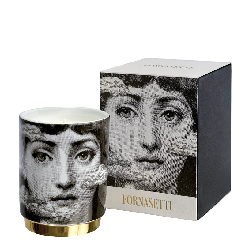 Fornasetti candle with matching packaging featuring a black and white design.