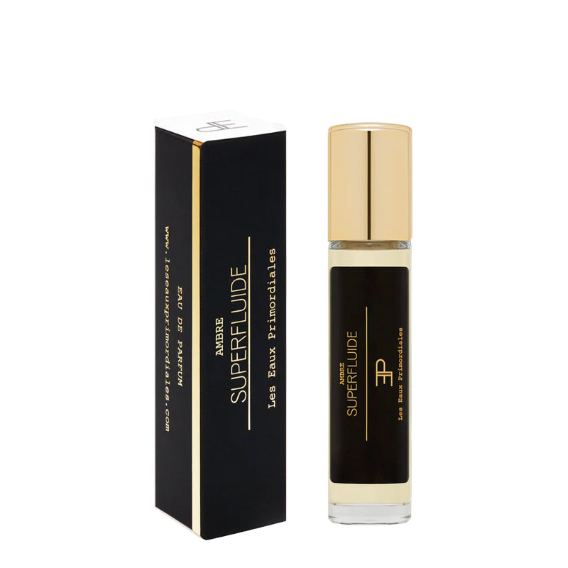 Black and gold Superfluide perfume bottle and packaging on a white background. Ambre Superfluide EdP - Superfluide Collection | Les Eaux Primordiales

