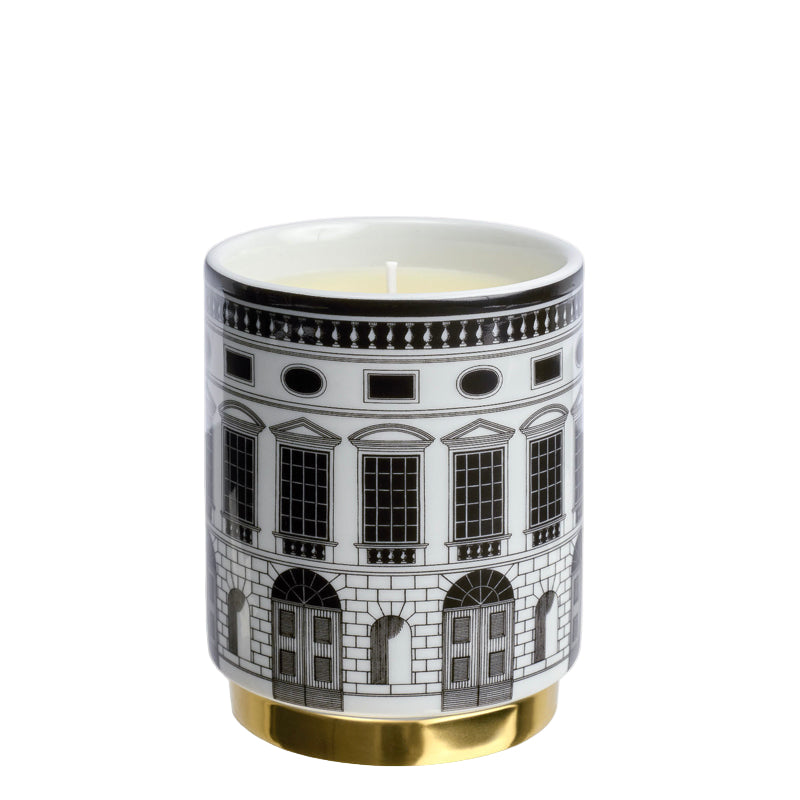 Candle in a container with architectural design on a white background