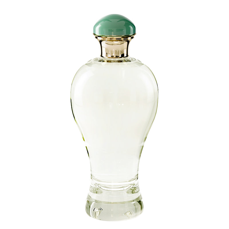 Kigriz - Eau de Parfum | Lubin Paris | AEDES.COM. Clear glass perfume bottle with a green cap on a white background