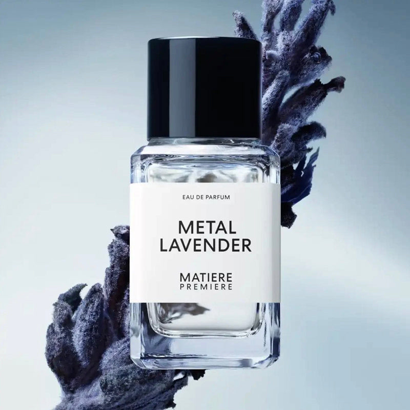 Perfume bottle labeled 'Metal Lavender' by Matiere Premiere with lavender flowers on a light gray background