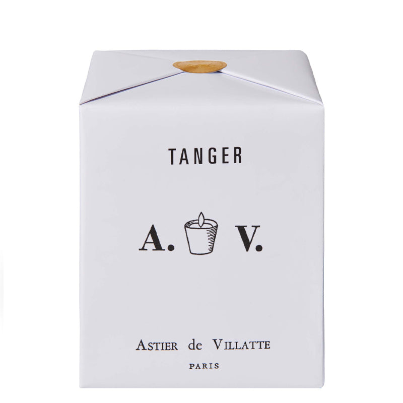 A white rectangular product box containing the candle with black printed text reading 'TANGER', 'A. V. and Astier de Villatte Paris