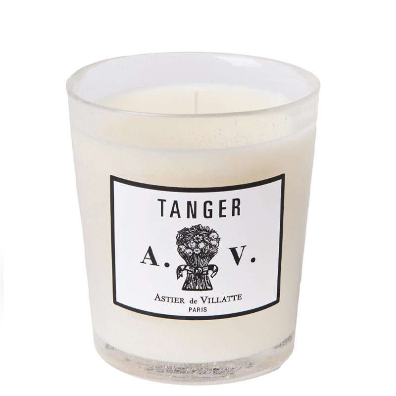 Tanger Candle by Astier de Villatte.  White label on a clear glass with the name Tanger - Astier de Villatte Paris. A.V. initials