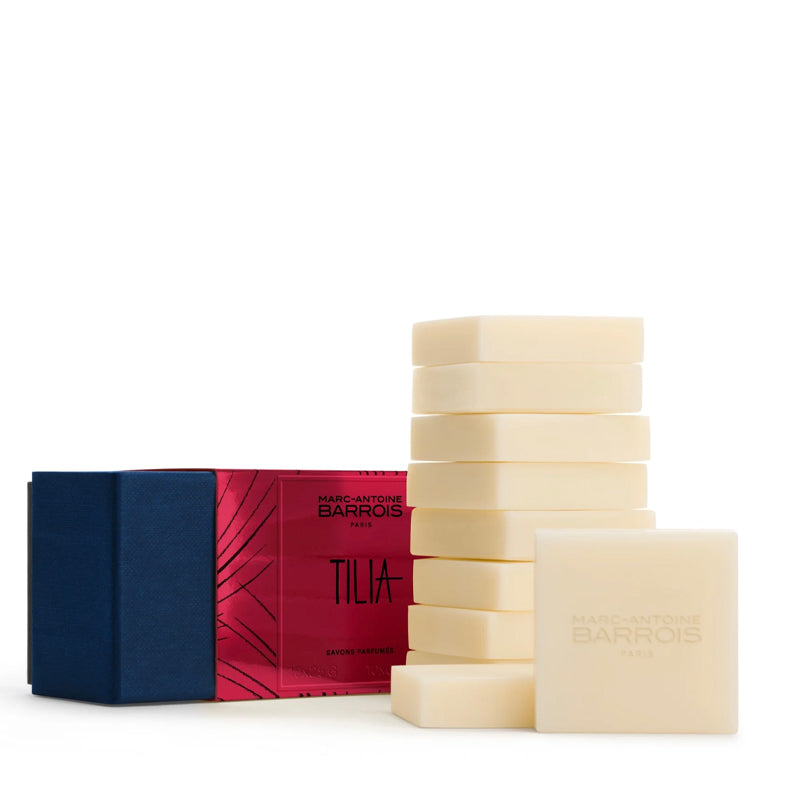 A set of Marc Antoine Barois Tilia Eau de Parfum soap bars, featuring a stack of cream-colored guest soap bars next to their packaging box.